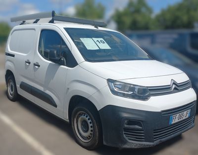 a white van that is parked in a parking lot
