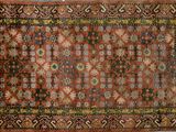tapis persan ancien à motif floral sur fond rouge