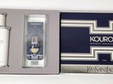 a close up of a bottle of cologne next to a box