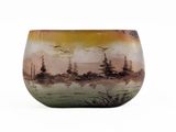 a vase with a painting on it sitting on a table