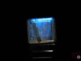 an image of a square glass object in the dark