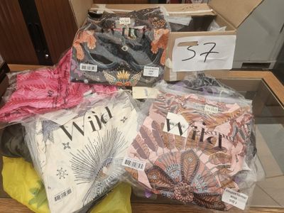 many different types of shirts on display in a box