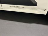 a close up of a car door handle with a sticker on it