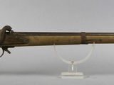 an old rifle with a wooden barrel and a wooden case