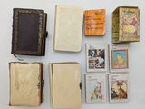 an image of a collection of old books on a white surface