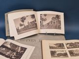 an open book sitting on top of a table next to a bunch of pictures