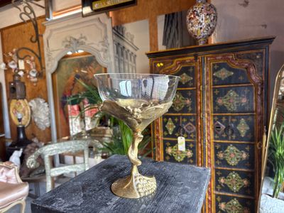 a glass bowl sitting on top of a table in a room