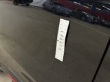 the door handle of a car with a sticker on it ' s side