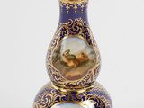 an image of a vase with a painting on it on a white surface