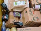 many different types of bottles and cans in this box