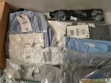 a box full of men ' s shirts and pants in it