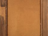 an old picture frame with a brown paper on it