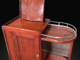 an old wooden cabinet with a mirror on top of it