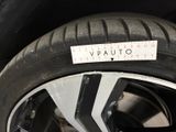 a close up of a tire with a sticker on it