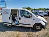 a white van that is parked in a parking lot