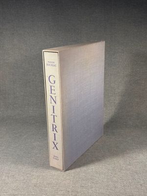 an open book sitting on top of a table on a gray surface