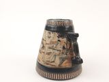 a black and white vase with a picture of a man and a woman on it