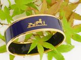 a bracelet with a picture of a horse and carriage on it