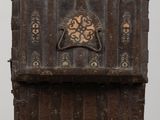 an old wooden chest with a decorative design on the front