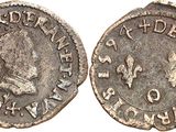 a silver coin with the image of a man on it