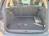 a trunk of a car with the back seats folded down