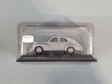 a small toy car in a clear box