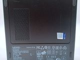 the back of a black laptop with a red sticker on the side of it