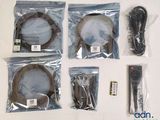 four remote controls in the bags on the table