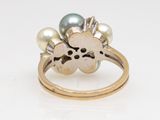 an image of a skull and crossbone ring with pearls