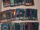 a bunch of cards are sitting on a bed with a white sheet