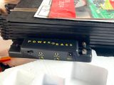 a stack of electronics sitting on top of a table