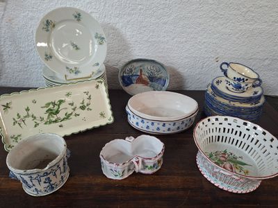 many different types of dishes and bowls on the table