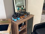 a table with bottles of essential oils on it in a room