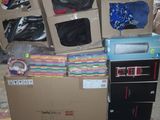 a pile of boxes with clothes on top of them