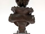 an image of a bronze statue of a woman holding a baby