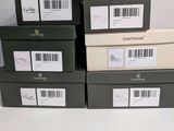 four boxes of different sizes and colors of boxes on a white surface