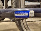 a close up of a bicycle with a bicycle code tag on it