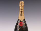 a close up of a bottle of moet champagne on a table