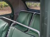 two seats in the back of a bus with a view of a vineyard