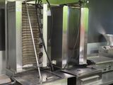 many machines that are cooking food in the kitchen