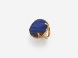 a lapis ring with a blue stone in the center