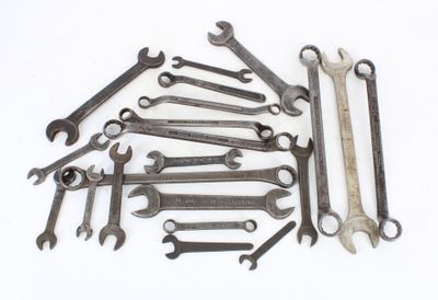 a lot of wrenches that are sitting on a table