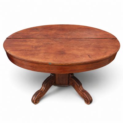 une table à manger ronde à quatre pieds, avec un plateau en bois