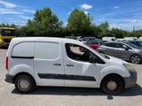a white van that is parked in a parking lot