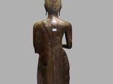 an image of a statue of a person in a brown outfit