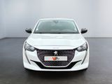 the front view of a white car parked in a showroom