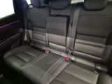 the back seats of a car are black and grey in color