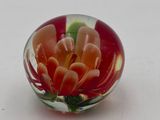 a glass ball with a flower inside of it