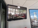 a television mounted on the wall in a room