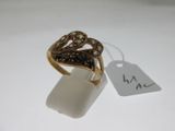 an image of a gold ring with a black diamond on it